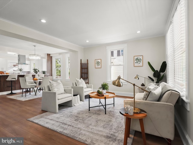2912 Shirey Ave, Baltimore, MD 21214 - living area featuring wood-type flooring, crown molding, recessed lighting, and baseboards
