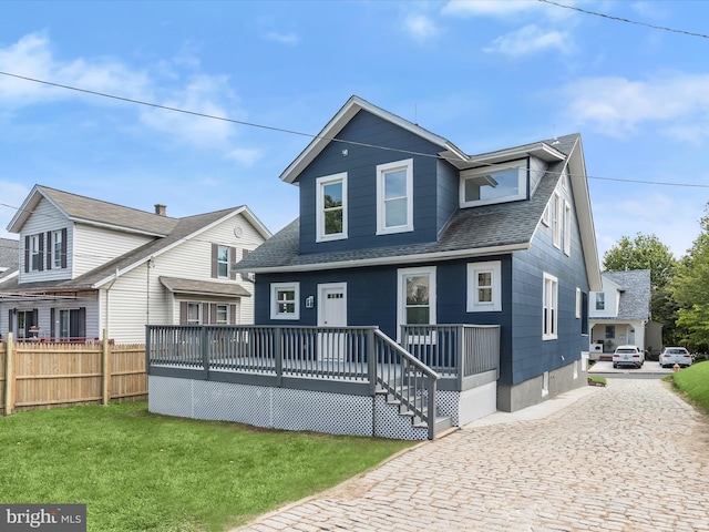 2912 Shirey Ave, Baltimore, MD 21214 - view of front facade with roof with shingles and a deck