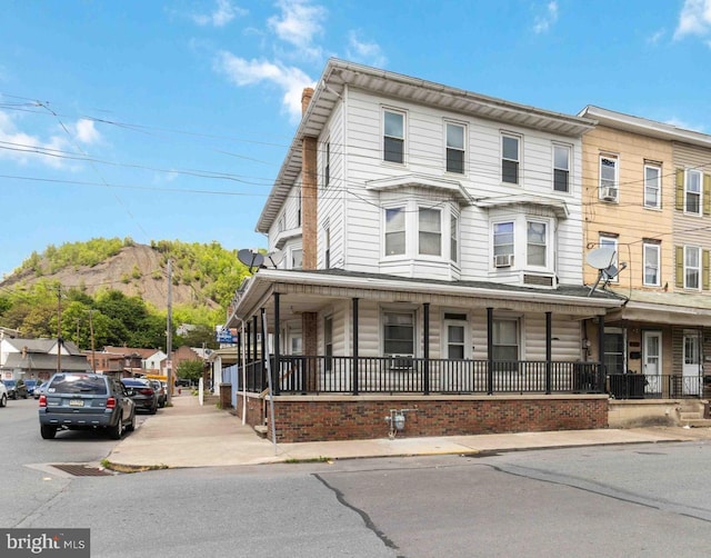 247 W Walnut St, Shamokin, PA 17872 - view of property featuring a porch and a chimney
