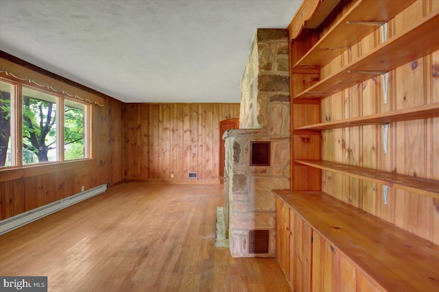129 Shippensburg Rd, Shippensburg, PA 17257 - spare room with light wood-style floors, a baseboard heating unit, and wood walls