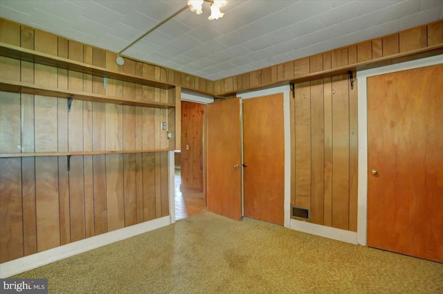 129 Shippensburg Rd, Shippensburg, PA 17257 - spare room with wood walls and carpet