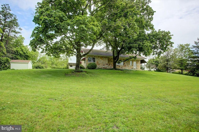 129 Shippensburg Rd, Shippensburg, PA 17257 - view of grassy yard featuring a shed and an outbuilding