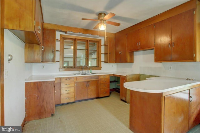 129 Shippensburg Rd, Shippensburg, PA 17257 - kitchen with brown cabinetry, a ceiling fan, a sink, and light countertops