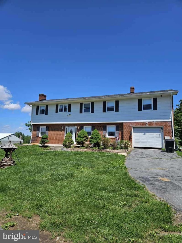 10110 Old Liberty Rd, Frederick, MD 21701 - multi unit property with a chimney, brick siding, driveway, and an attached garage