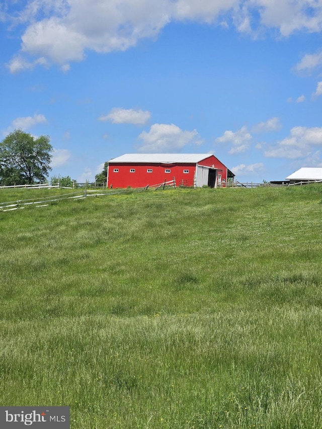 10110 Old Liberty Rd, Frederick, MD 21701 - view of green lawn with a pole building, an outdoor structure, and a view of countryside