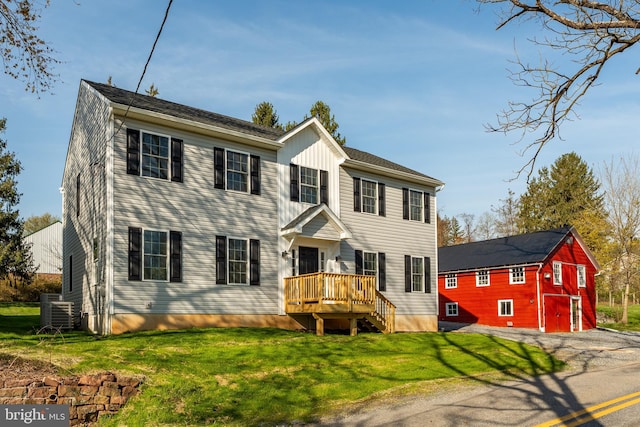 25 Railroad St, Denver, PA 17517 - colonial home with a wooden deck, a front yard, and cooling unit