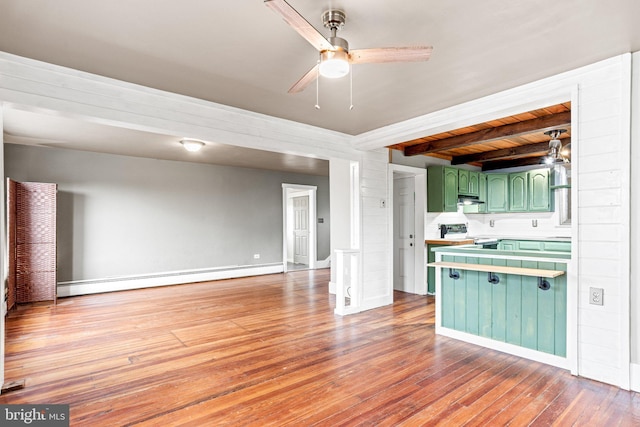 9054 William Penn Hwy, Mifflintown, PA 17059 - kitchen featuring green cabinets, ceiling fan, range with electric cooktop, open floor plan, and hardwood / wood-style floors