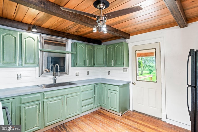 9054 William Penn Hwy, Mifflintown, PA 17059 - kitchen featuring wood ceiling, beam ceiling, a sink, green cabinets, and freestanding refrigerator