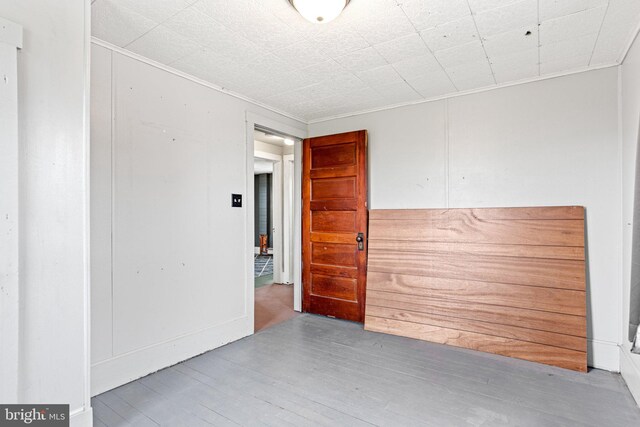 9054 William Penn Hwy, Mifflintown, PA 17059 - spare room with wood finished floors and ornamental molding