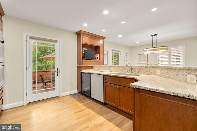1802 24th St S, Arlington, VA 22202 - kitchen featuring dishwasher, brown cabinets, light wood finished floors, plenty of natural light, and recessed lighting