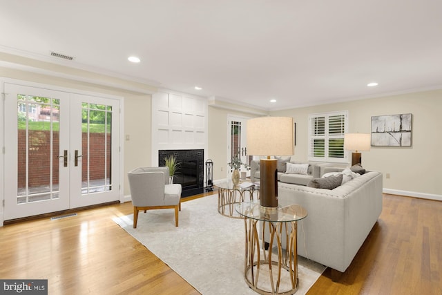 1802 24th St S, Arlington, VA 22202 - living area featuring recessed lighting, wood finished floors, french doors, a fireplace, and crown molding