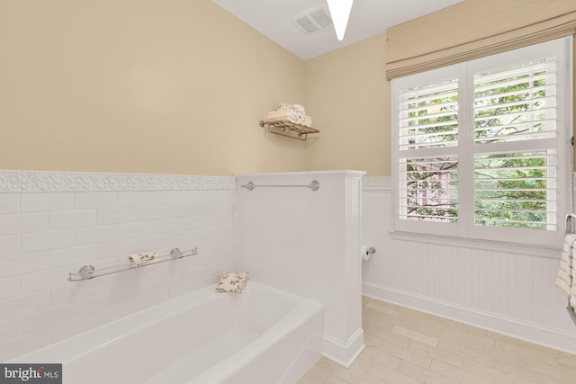 1802 24th St S, Arlington, VA 22202 - bathroom with a garden tub, wainscoting, and tile patterned floors