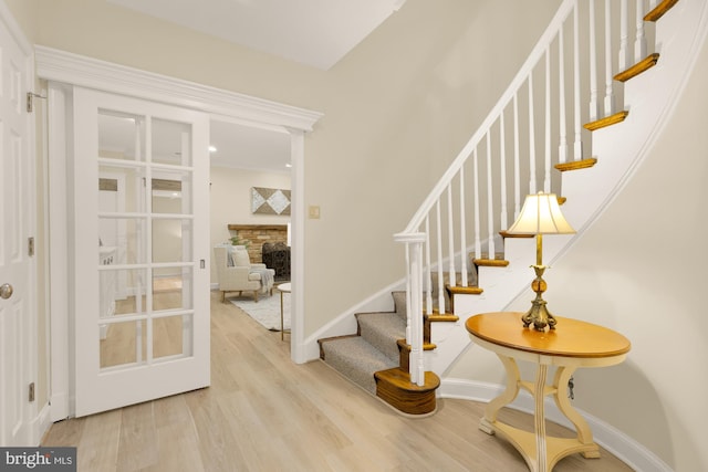 1802 24th St S, Arlington, VA 22202 - staircase with wood finished floors and a fireplace
