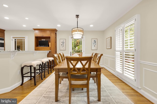 1802 24th St S, Arlington, VA 22202 - dining room featuring recessed lighting, a wainscoted wall, light wood-type flooring, and a decorative wall