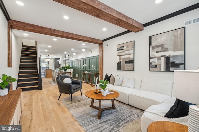 826 Tasker St, Philadelphia, PA 19148 - living room featuring stairs, beam ceiling, wood finished floors, recessed lighting, and crown molding