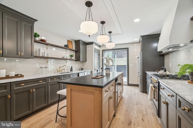 826 Tasker St, Philadelphia, PA 19148 - kitchen with stainless steel appliances, a sink, open shelves, wall chimney range hood, and backsplash