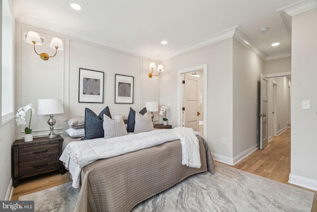 826 Tasker St, Philadelphia, PA 19148 - bedroom with light wood-type flooring, crown molding, recessed lighting, baseboards, and connected bathroom