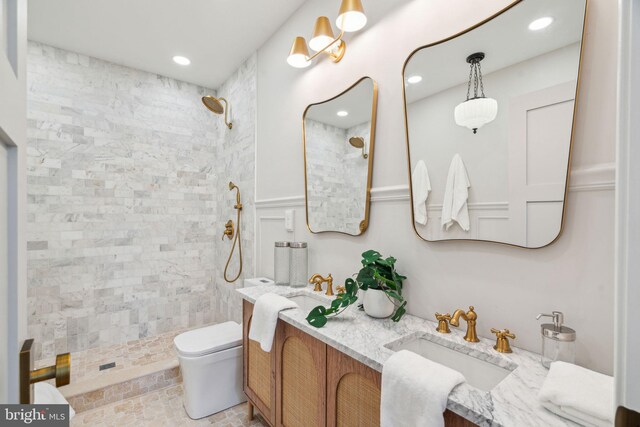 826 Tasker St, Philadelphia, PA 19148 - full bathroom featuring toilet, tiled shower, double vanity, and recessed lighting