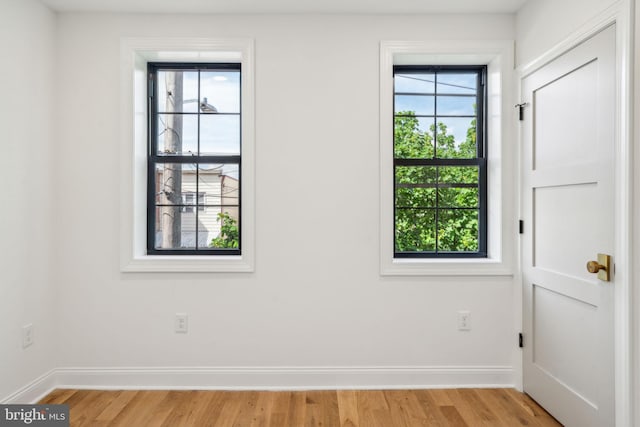 826 Tasker St, Philadelphia, PA 19148 - empty room with baseboards and light wood-style flooring