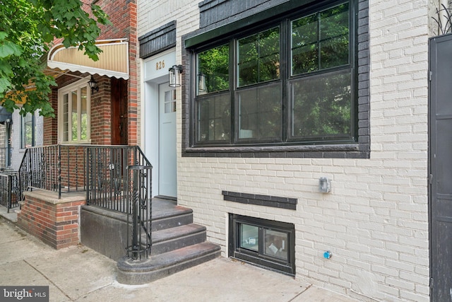 826 Tasker St, Philadelphia, PA 19148 - doorway to property with brick siding