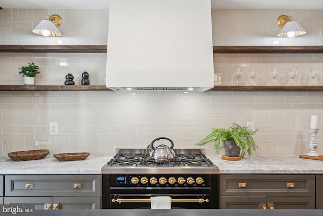 826 Tasker St, Philadelphia, PA 19148 - kitchen with stainless steel range, backsplash, open shelves, and light stone counters