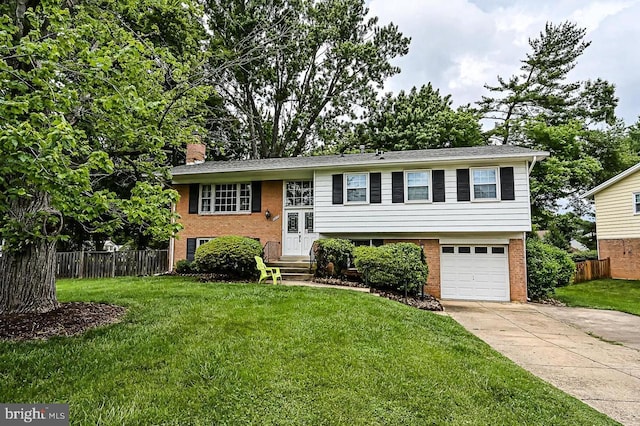 8818 Olympia Fields Ln, Vienna, VA 22182 - split foyer home with a chimney, driveway, brick siding, and a garage