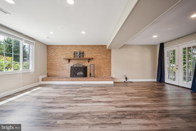 8818 Olympia Fields Ln, Vienna, VA 22182 - unfurnished living room with a fireplace, plenty of natural light, wood finished floors, baseboards, and recessed lighting