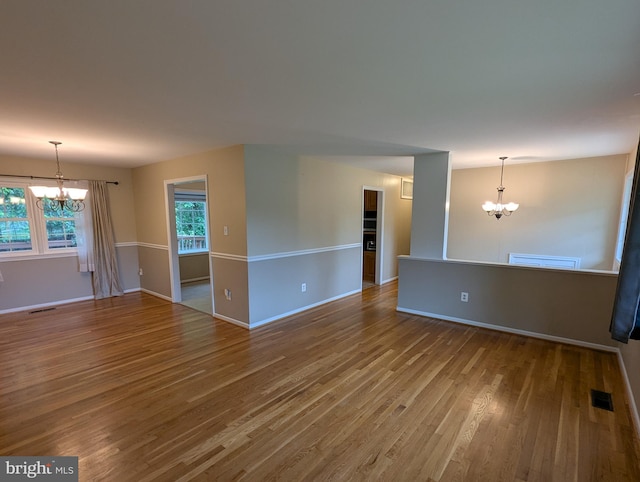 8818 Olympia Fields Ln, Vienna, VA 22182 - spare room with a chandelier, baseboards, and wood finished floors