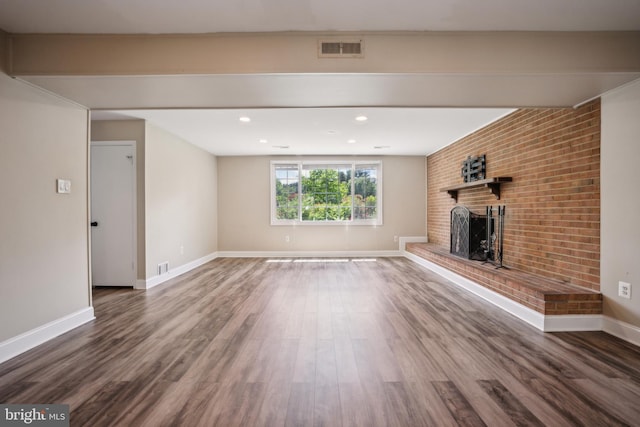 8818 Olympia Fields Ln, Vienna, VA 22182 - unfurnished living room featuring a brick fireplace, wood finished floors, baseboards, and recessed lighting