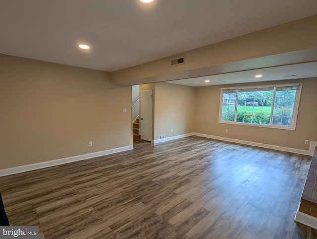 8818 Olympia Fields Ln, Vienna, VA 22182 - empty room featuring dark wood-style flooring, stairs, baseboards, and recessed lighting