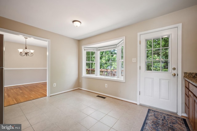 8818 Olympia Fields Ln, Vienna, VA 22182 - entrance foyer with a chandelier, baseboards, and light tile patterned floors