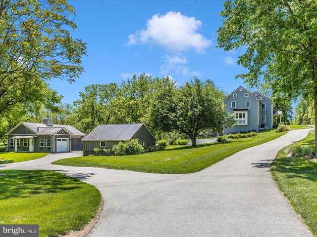 15953 River Bend Ct, Williamsport, MD 21795 - view of home's community featuring a yard, a garage, and asphalt driveway