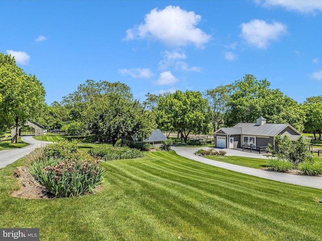 15953 River Bend Ct, Williamsport, MD 21795 - view of green lawn with driveway and an attached garage