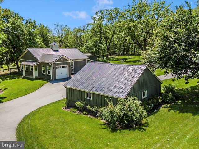 15953 River Bend Ct, Williamsport, MD 21795 - view of front of home with a front yard, driveway, a metal roof, and a garage