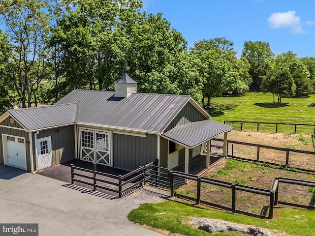 15953 River Bend Ct, Williamsport, MD 21795 - view of front facade with an exterior structure, board and batten siding, an outbuilding, and a metal roof