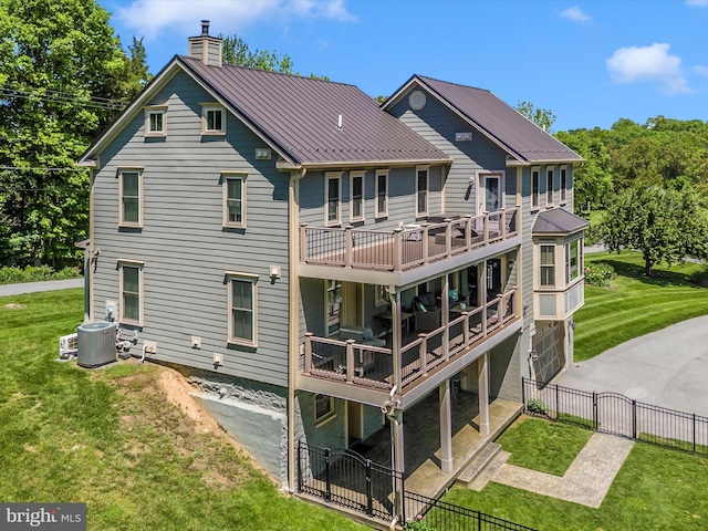 15953 River Bend Ct, Williamsport, MD 21795 - back of house featuring a chimney, a gate, a metal roof, a wooden deck, and a standing seam roof