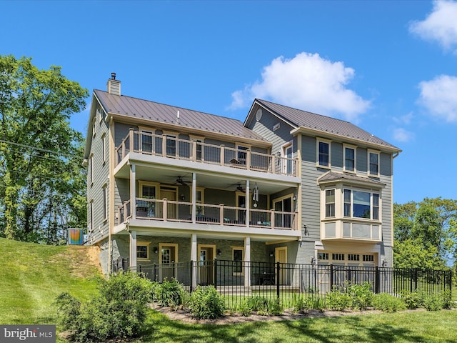 15953 River Bend Ct, Williamsport, MD 21795 - rear view of property featuring a balcony, ceiling fan, a chimney, a metal roof, and an attached garage