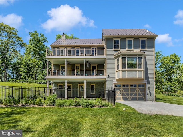 15953 River Bend Ct, Williamsport, MD 21795 - rear view of property featuring a balcony, driveway, a chimney, an attached garage, and a metal roof