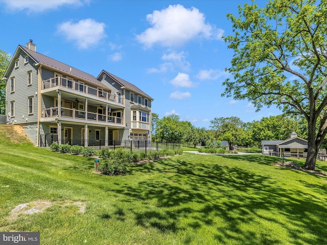 15953 River Bend Ct, Williamsport, MD 21795 - back of house with a balcony, a ceiling fan, a chimney, a metal roof, and a standing seam roof