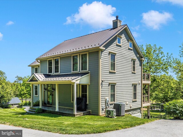 15953 River Bend Ct, Williamsport, MD 21795 - back of property with a chimney, a standing seam roof, a porch, and a metal roof