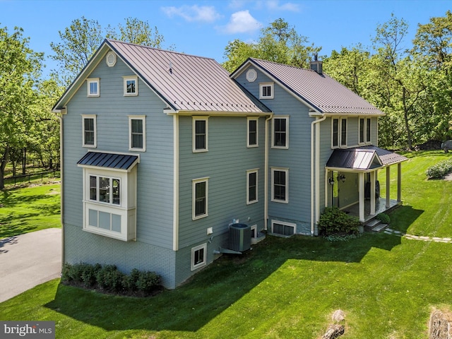 15953 River Bend Ct, Williamsport, MD 21795 - back of house featuring a standing seam roof, a metal roof, and a yard