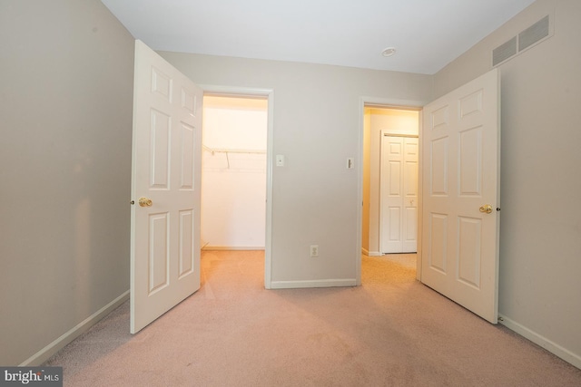 28 Woodstream Dr, Chesterbrook, PA 19087 - unfurnished bedroom with light colored carpet, baseboards, and a spacious closet