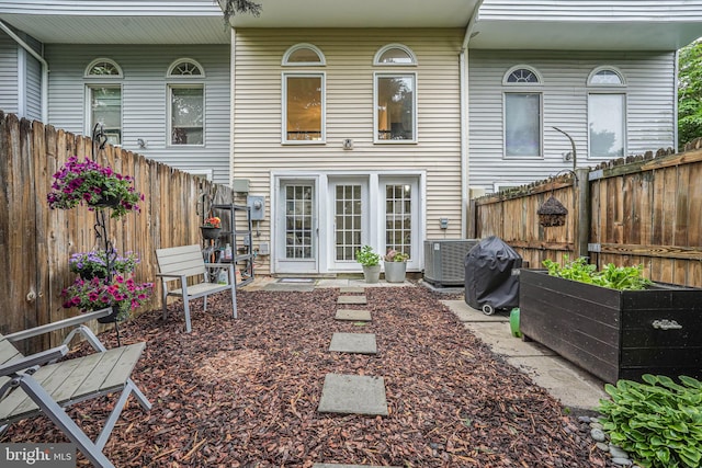 13916 Preacher Chapman Pl, Centreville, VA 20121 - back of property featuring a fenced backyard and central AC unit