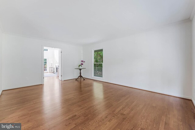 6808 Canal Bridge Ct, Potomac, MD 20854 - empty room with ornamental molding, wood finished floors, and baseboards