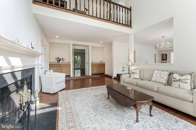 6808 Canal Bridge Ct, Potomac, MD 20854 - living room featuring wood finished floors, a chandelier, a fireplace with flush hearth, and recessed lighting