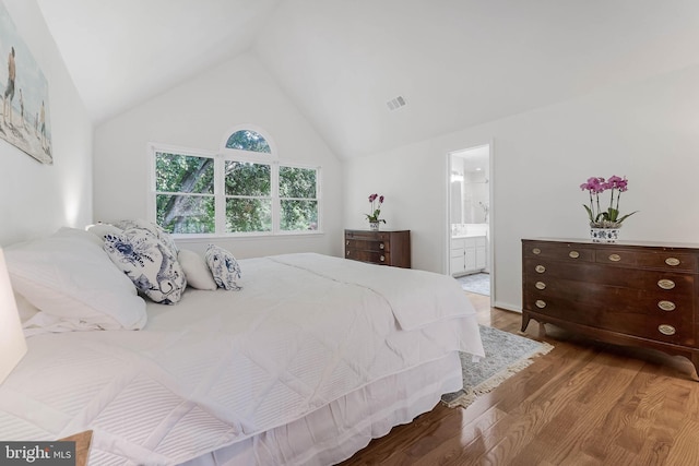 6808 Canal Bridge Ct, Potomac, MD 20854 - bedroom featuring wood finished floors, ensuite bathroom, and high vaulted ceiling