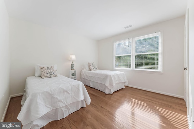 6808 Canal Bridge Ct, Potomac, MD 20854 - bedroom featuring baseboards and wood finished floors