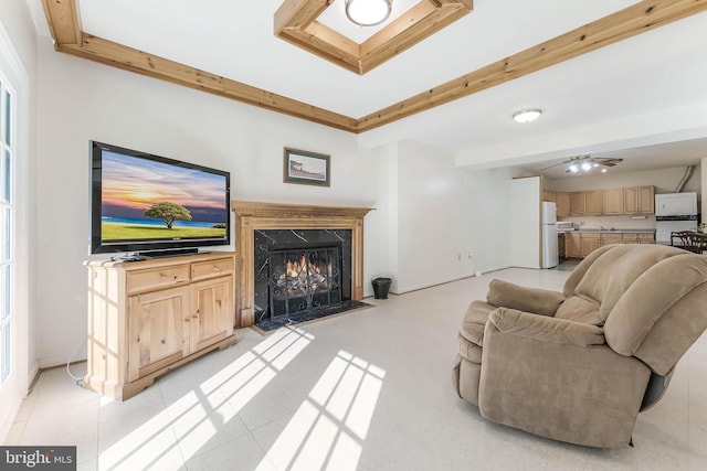 6808 Canal Bridge Ct, Potomac, MD 20854 - living area with a high end fireplace, beamed ceiling, and baseboards