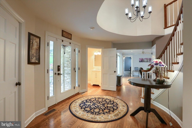 1715 Mountain View Rd, Harrisburg, PA 17110 - entryway featuring light wood-style flooring, stairs, baseboards, a chandelier, and a ceiling fan