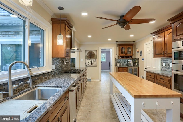 1715 Mountain View Rd, Harrisburg, PA 17110 - kitchen with a sink, wooden counters, crown molding, decorative backsplash, and a ceiling fan